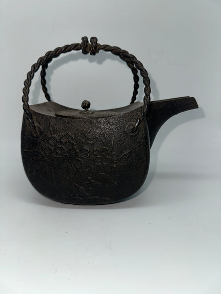 Japanese Iron Tetsubin Tea Pot. Twisted Handle. Cherry Blossom Motif.