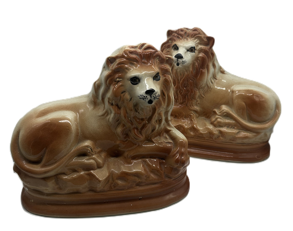 Pair of Staffordshire Pottery Lions. Late 19th century. 11" Length