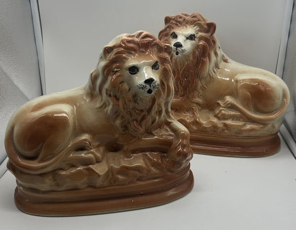 Pair of Staffordshire Pottery Lions. Late 19th century. 11" Length