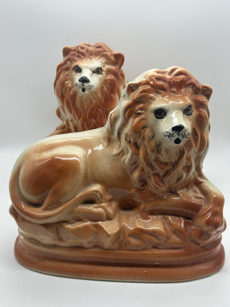 Pair of Staffordshire Pottery Lions. Late 19th century. 11" Length