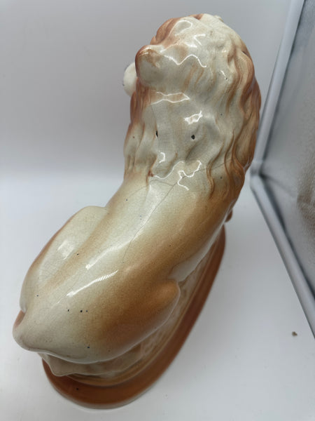 Pair of Staffordshire Pottery Lions. Late 19th century. 11" Length