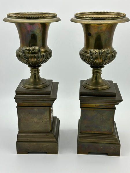 Pair Urns on Pedestal. Brass with Classical Scenes. 12" Height