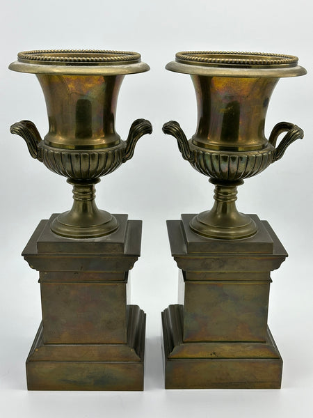 Pair Urns on Pedestal. Brass with Classical Scenes. 12" Height