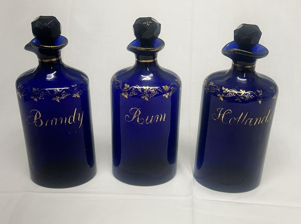Three Liquor Decanters. Bristol Blue and Gold Glass. 18th Century