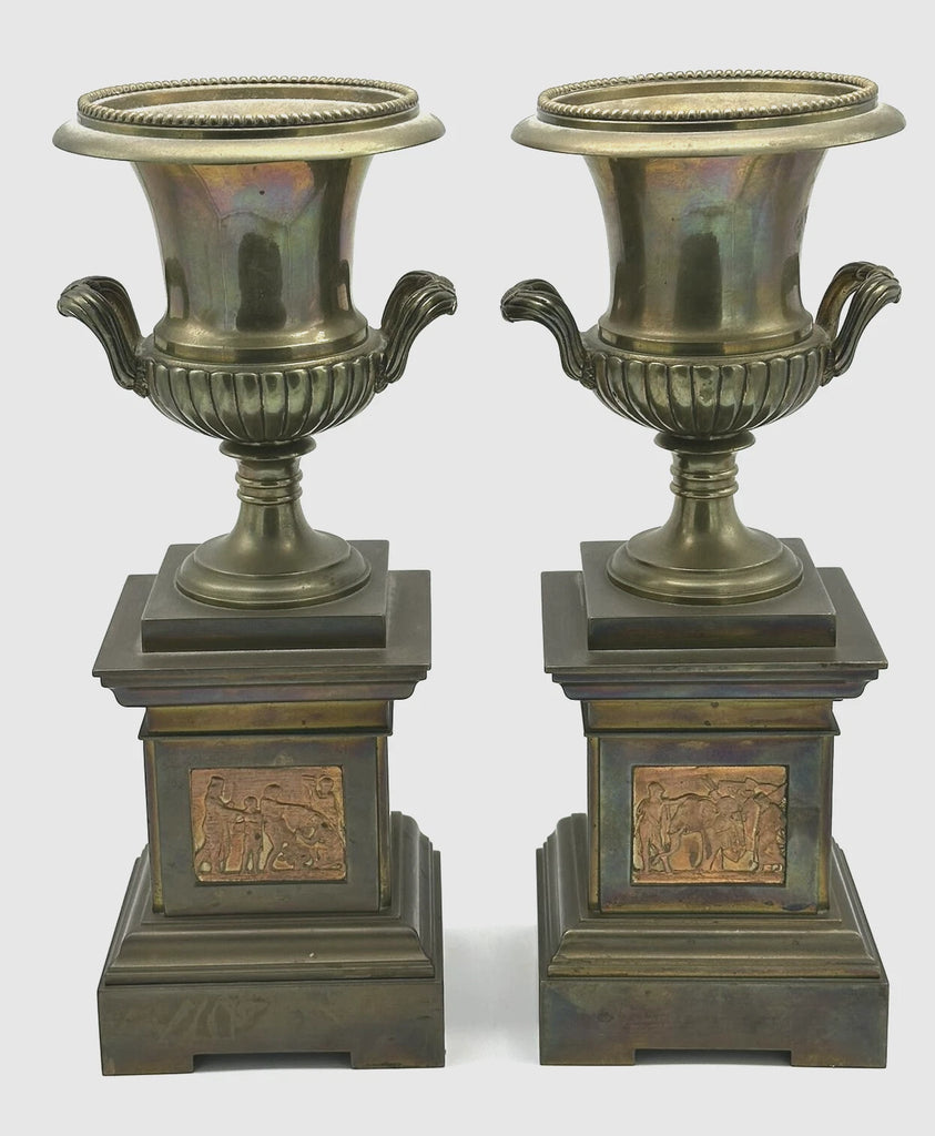 Pair Urns on Pedestal. Brass with Classical Scenes. 12" Height