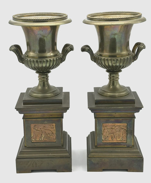 Pair Urns on Pedestal. Brass with Classical Scenes. 12" Height